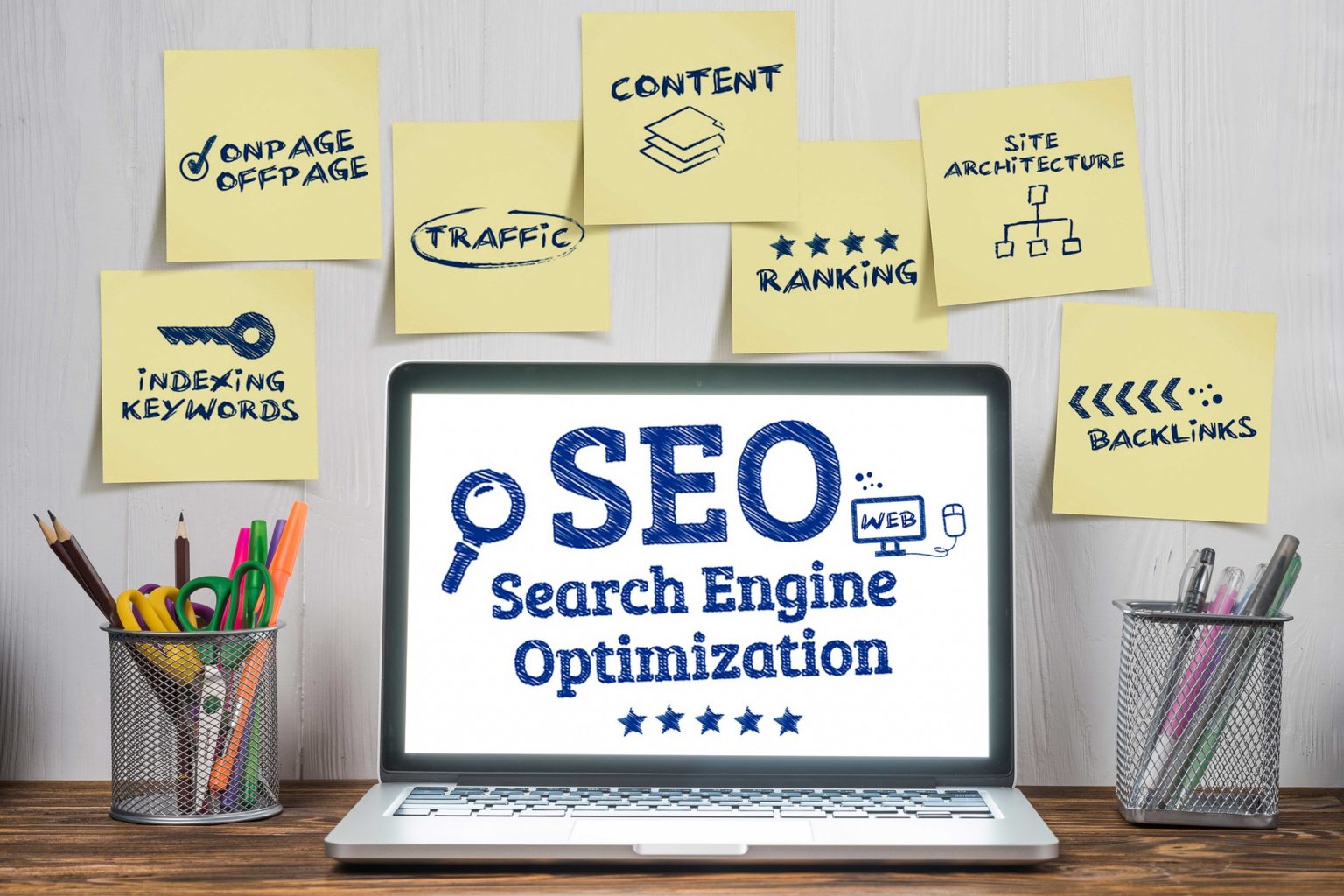 A laptop with the words seo search engine optimization on it.