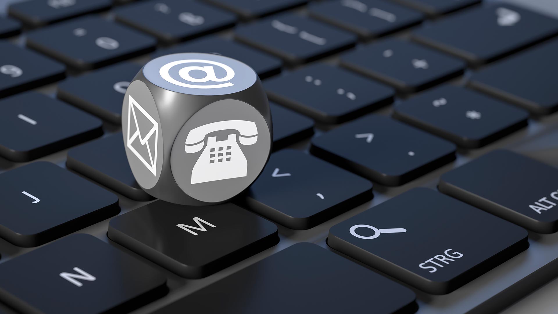 An email icon sits on top of a keyboard.