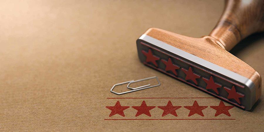 A rubber stamp with five stars on it.