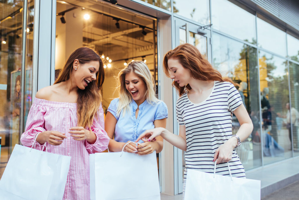 business strategies - friends enjoying retail therapy