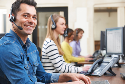 A group of people working in a call center.