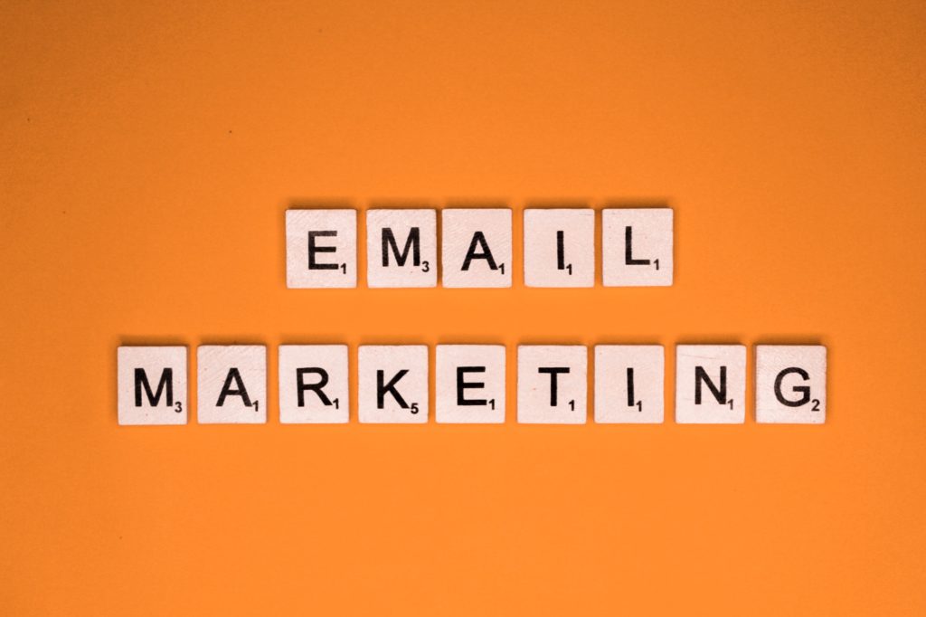 Email marketing scrabble letters word on a orange background